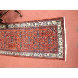 A mid 20th century red ground runner, Iran 16'4" x 2'10"