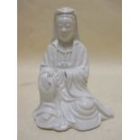 A blanc de Chine figure of Guanyin, a Yixing tea pot and a Guangdong fisherman (3)