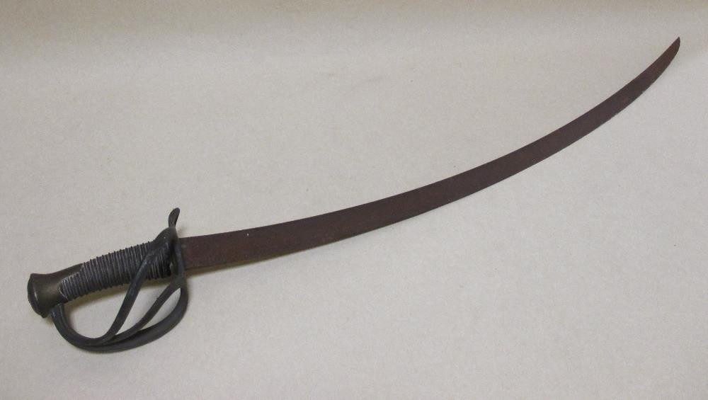 A 19th century French cavalry trooper's sabre with brass hilt and wire grip (lacks scabbard)