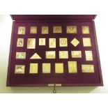 An Empire collection, silver gilt stamp set, cased together with certificates. Set No 2347/10000