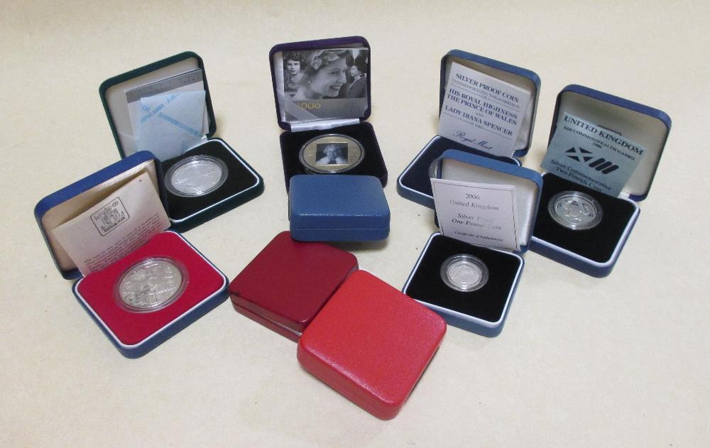 Royal Mint 1989 silver proof £1, a proof 1988 £1, a 2005 proof £1, a 2006 proof £1, a 1989 silver