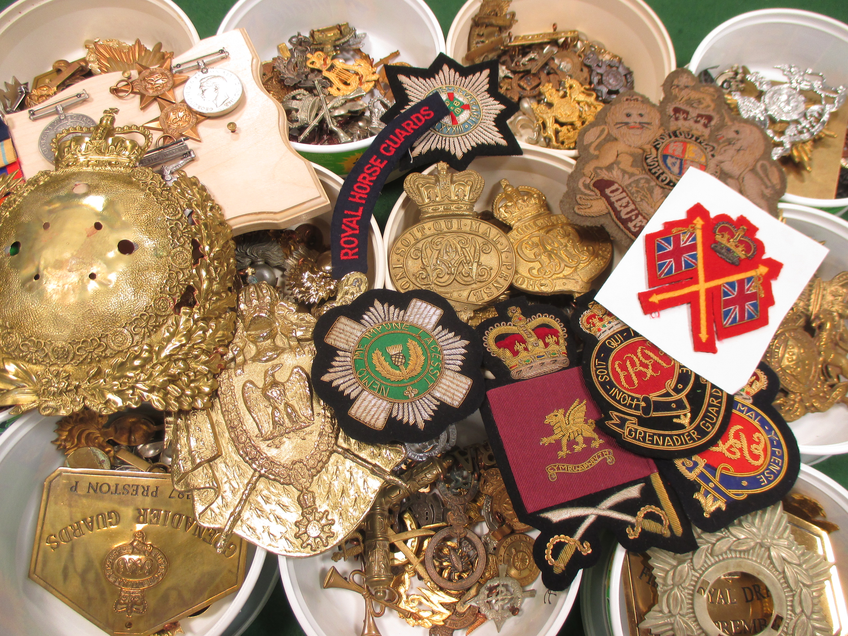 A quantity of military badges, insignias etc. (some modern)