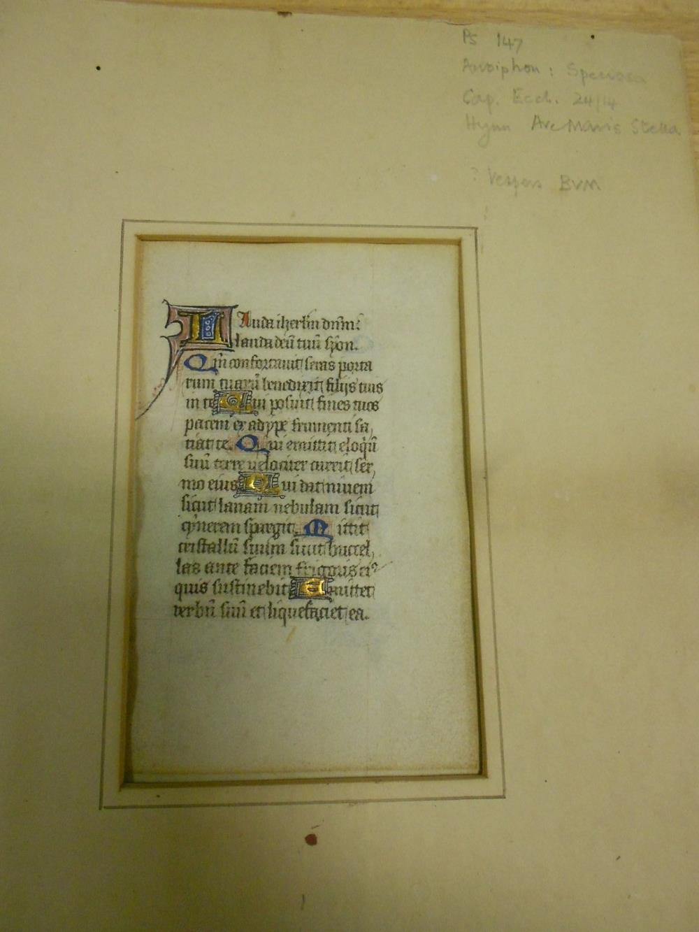 An illuminated Manuscript vellum leaf, highlighted in gilt, with verse with decorative capitals to