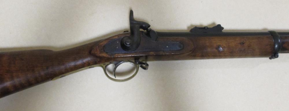 A musket with three banded barrel, the lock stamped 'Tower' with Crown over VR