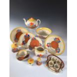 A Clarice Cliff Crocus pattern tea service, comprising teapot and cover, milk jug, preserve pot