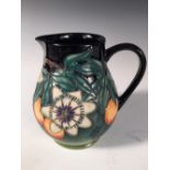 A Moorcroft Passion Fruit pattern jug, with painted and impressed marks, dated (19)97 14cm (5in)