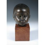 Dora Gordine (British, 1906-1991), a bronze portrait head of a child, with dark brown patination,