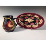 A Moorcroft Cherries pattern bowl, of oval form, together with a Queen's Choice pattern jug (2)