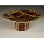 A 20th century studio pottery tazza, the large dished circular top with an arrangement of glazed and