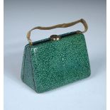 An Art Deco faux shagreen enamel minaudiere, in the form of a rigid metal purse with a mesh chain