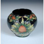 A Moorcroft Trial Thistle pattern vase, the globular form with painted and impressed marks, dated