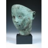 Dora Gordine (British, 1906-1991), a bronze mask of a Greek Boy, with green patination, signed and