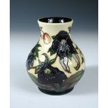 A Moorcroft trial Hellebore pattern vase, the baluster form with painted and impressed marks,