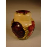 A Moorcroft Anemone pattern jar and cover, decorated to a yellow ground, impressed marks 11½cm (4in)