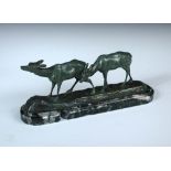 Irénée Rochard, (French, 1906-1984), a bronze model of two walking deer, with green patina,