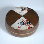 John Maltby (born 1936), a stoneware circular box and cover, the cover painted with resist panels