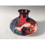 A Moorcroft Red Tulip pattern vase, of squat baluster form, painted and impressed marks 11cm (4in)