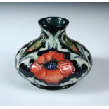 A Moorcroft Poppy pattern vase, of squat baluster form, painted and impressed marks, dated (19)96