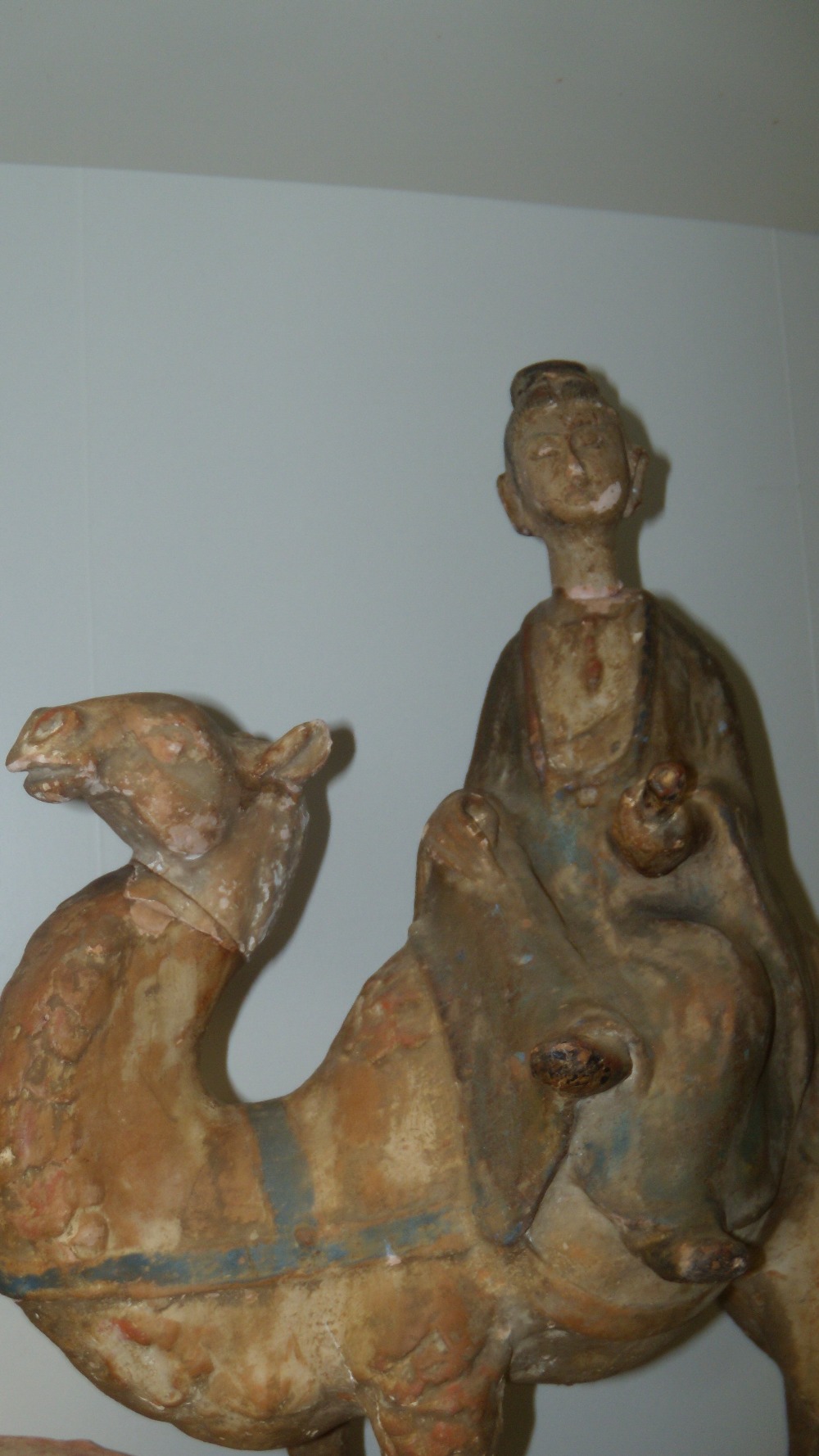 A Tang style camel, the figure riding side saddle on its back holds a scroll in his left hand, muted - Image 2 of 5