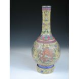 A Qianlong style bottle vase rotatable on its stand, painted with lappet bands enclosing the