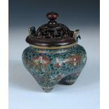 A 19th century cloisonne censer and wood cover, two lug handles raised above the polished circular