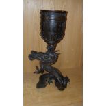 A late 19th/early 20th century bronze dragon and temple bell group, the roaring beast rises up