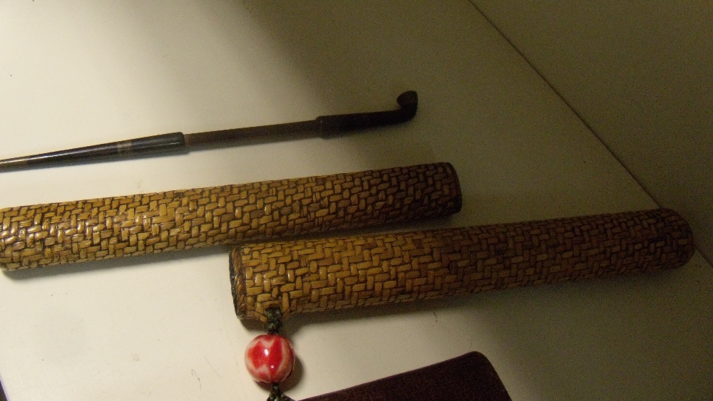 A pipe and tobacco pouch sagemono, the bamboo stemmed pipe with bowl and mouthpiece iroe on a - Image 2 of 4