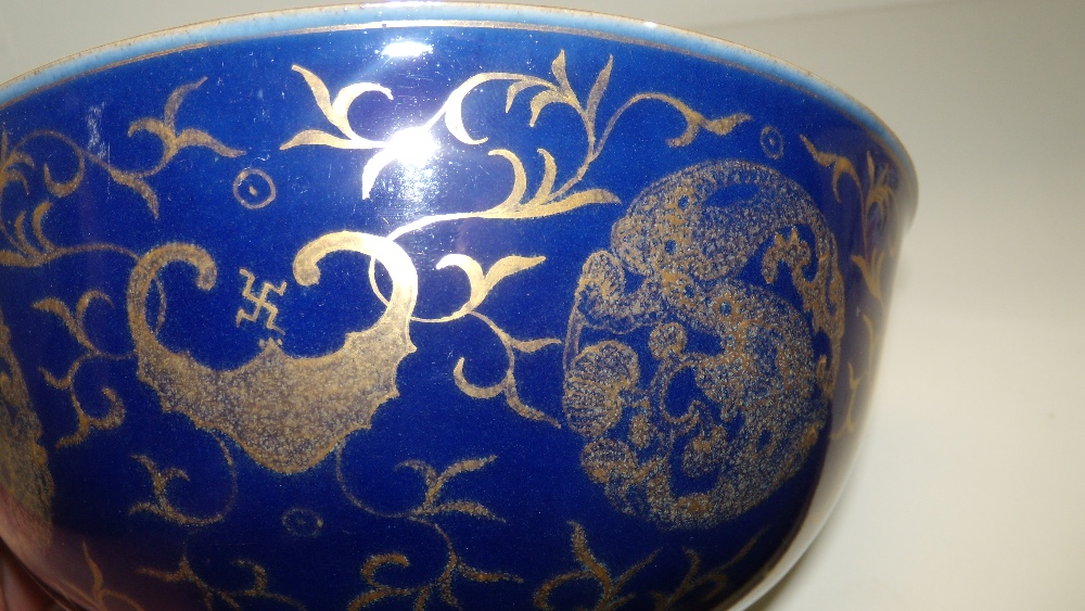 A pair of gilt powder blue ground bowls, seal marks of Qianlong, the exteriors with alternating bats - Image 3 of 3