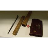 A pipe and tobacco pouch sagemono, the bamboo stemmed pipe with bowl and mouthpiece iroe on a