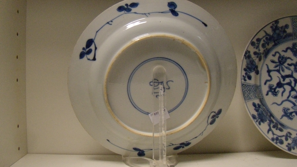 A pair of blue and white plates, period of Kangxi, and a later bowl, the plates painted with central - Image 4 of 5