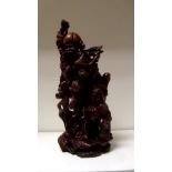 An early 20th century carved wood group depicting Shoulao, he stands with a crane and the base of