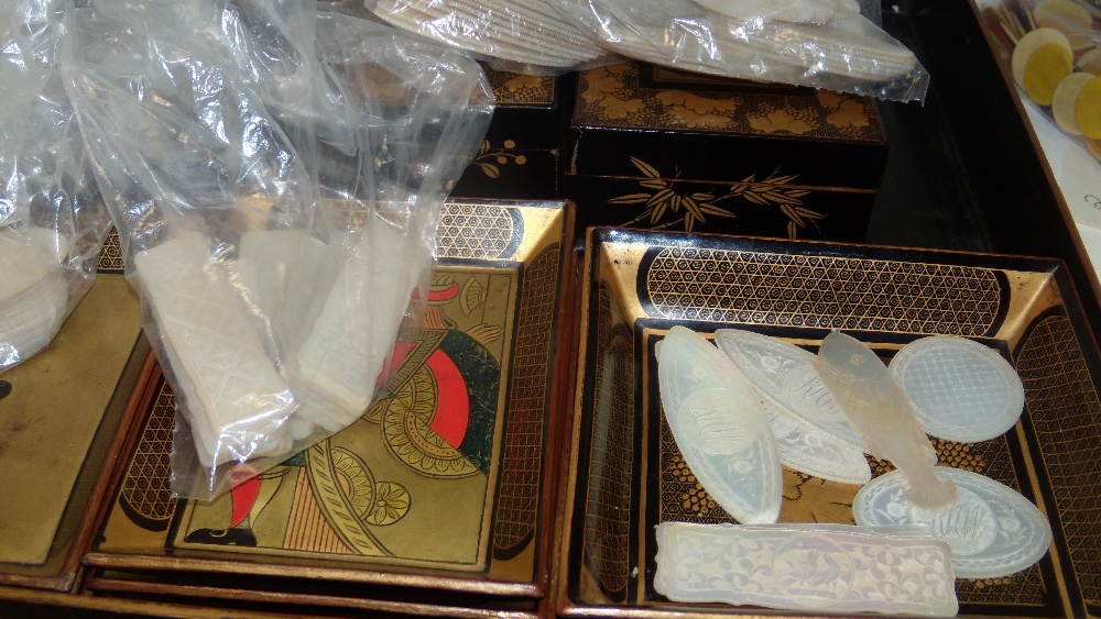 A mid 19th century black lacquer games box, gilt floral panels and grape vine bands enclosing the - Image 3 of 3