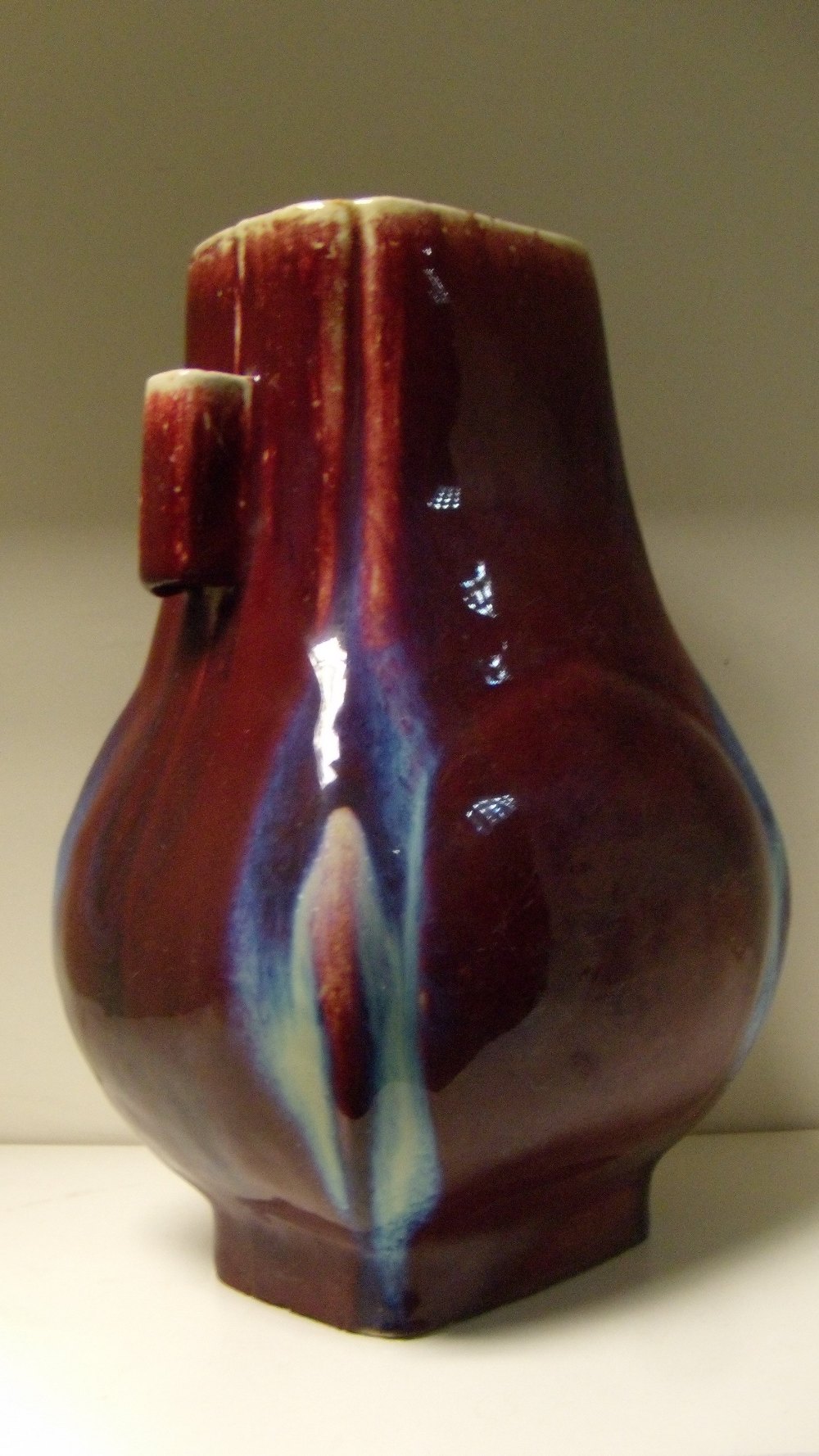 A flambe arrow vase of rectangular sectioned baluster shape, the broader sides of the body with