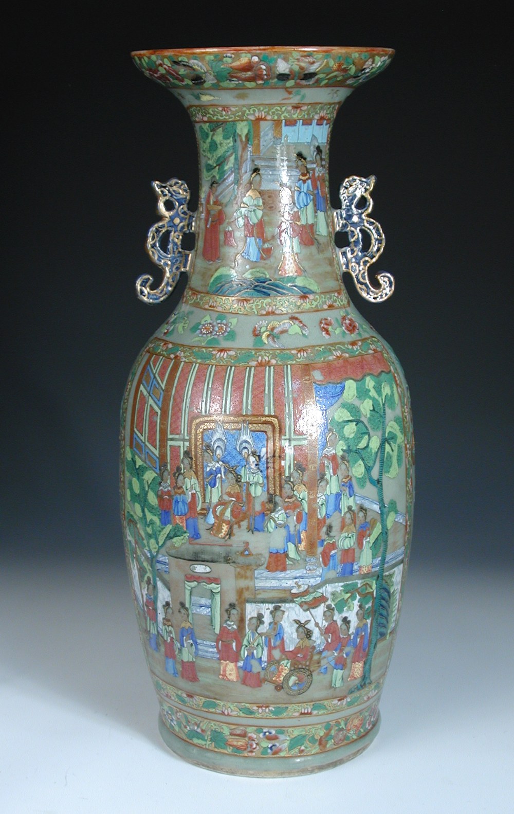 A 19th century Canton celadon ground vase, the neck with two dragon handles above a court scene