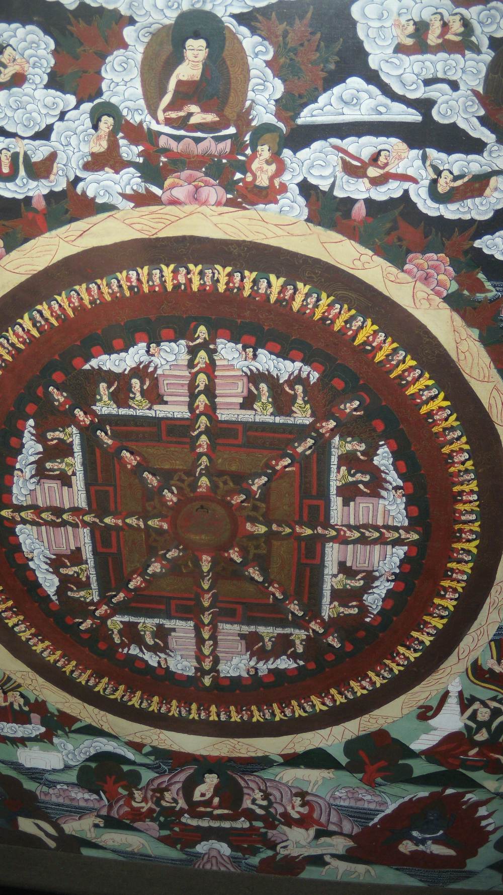 A Tibetan tangkha painted with the wheel of life enclosed by monks and other figures on clouds, 58 x - Image 2 of 2