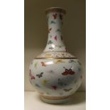 A 19th century famille rose bottle vase, six character mark of Guangxu, ruyi lappets in a band on