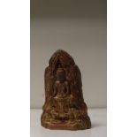 A Thai or Burmese terracotta Buddha, the niche in which he sits cross legged shaped to the