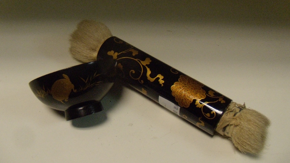 A lacquer make up brush and a bowl for tooth black, the black cylindrical handle to the double ended