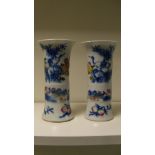 A pair of famille rose vases, the gu shapes painted with cranes, mandarin ducks,chrysanthemums,