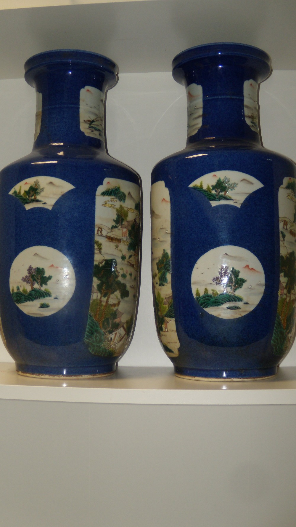 A pair of 19th century powder blue ground vases, each painted with canted rectangular and fan shaped - Image 2 of 3