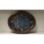 A 19th century cloisonne quatrefoil tray worked with two phoenix in an oval within floral and ruyi