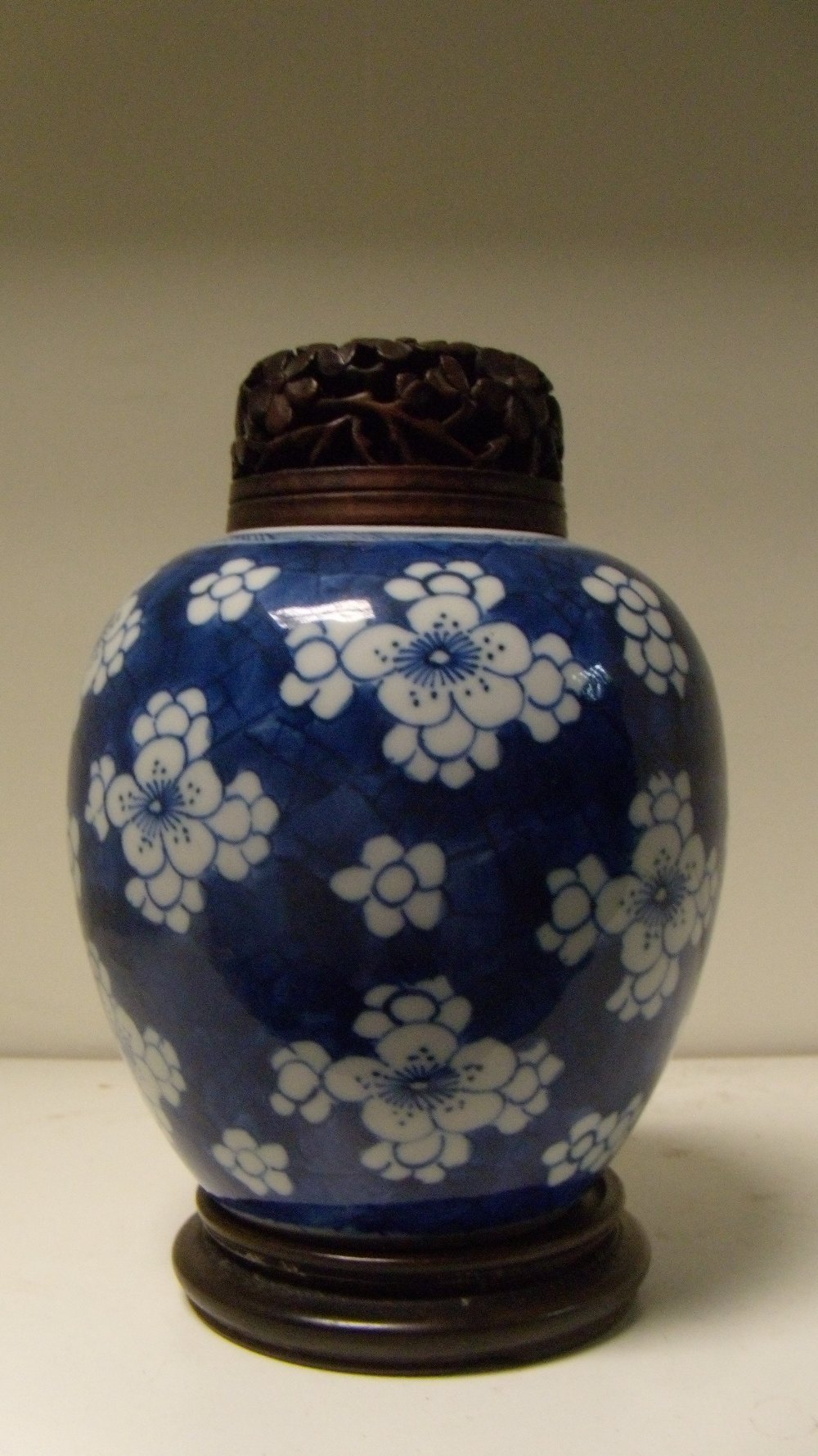 A blue and white jar with wood cover, period of Kangxi, the rounded sides painted with groups of