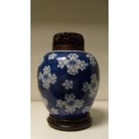 A blue and white jar with wood cover, period of Kangxi, the rounded sides painted with groups of