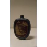 A Yixing blue snuff bottle, the red/brown recessed panels to each side of the flattened ovoid