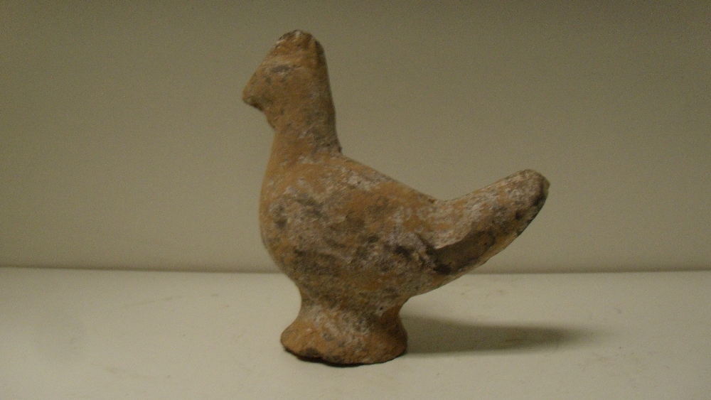 A Han dynasty grey pottery figure of a chicken, the bird supported on a flared circular foot, traces - Image 2 of 3