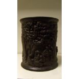 A hardwood brush pot, the exterior carved in relief with two riders approaching go player beneath