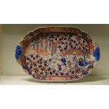 A late 19th century Fukugawa Imari tray, the rounded rectangular gallery with blue trefoil