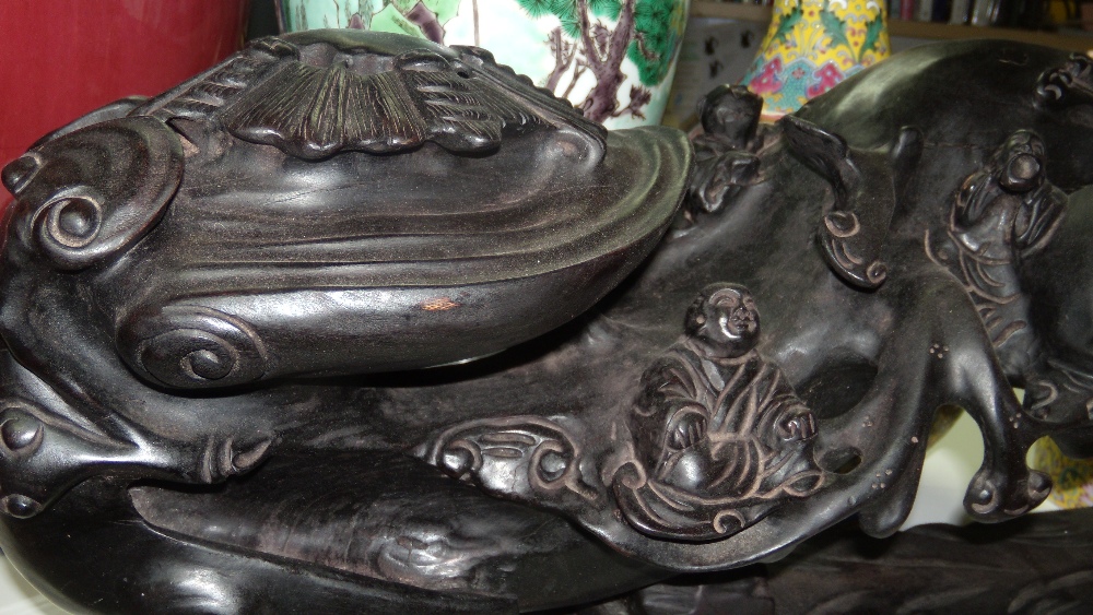 A zitan wood ruyi sceptre on stand, carved with Budai seated smiling to one end as children - Image 2 of 4