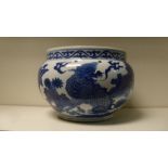 A Kangxi style blue and white bowl, the cylindrical rim painted with vines above the rounded sides