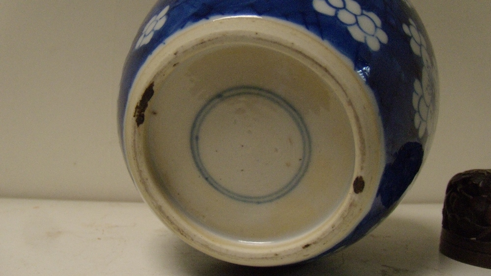 A blue and white jar with wood cover, period of Kangxi, the rounded sides painted with groups of - Image 2 of 3